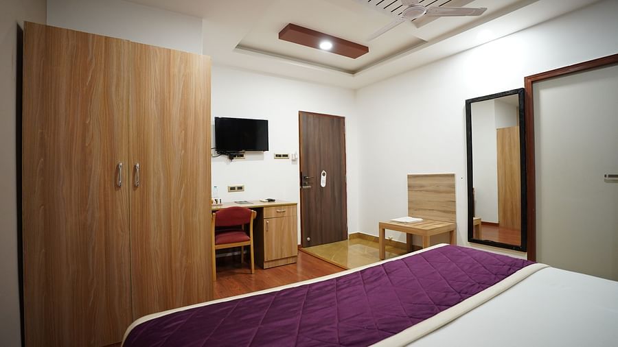 an image of a side view of the deluxe room with a television