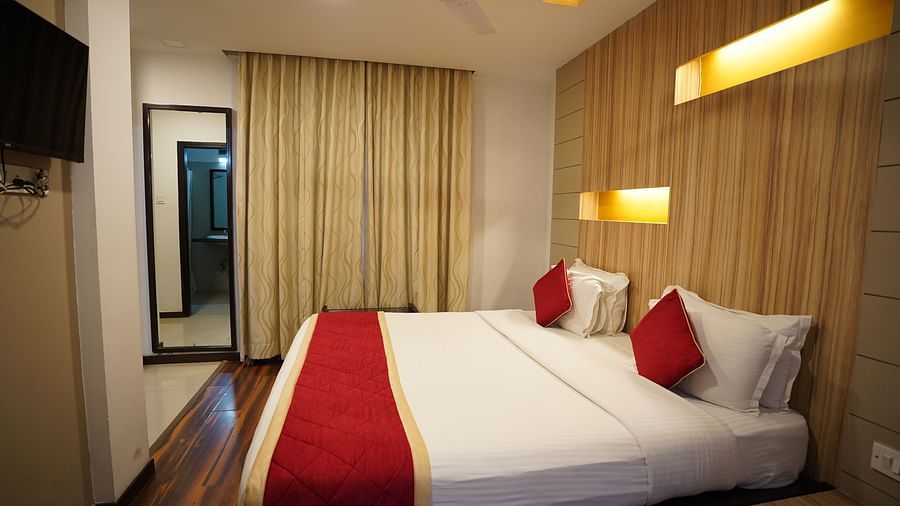 an image of a side view of the bedroom with a television at  City Centre Residency, Bangalore