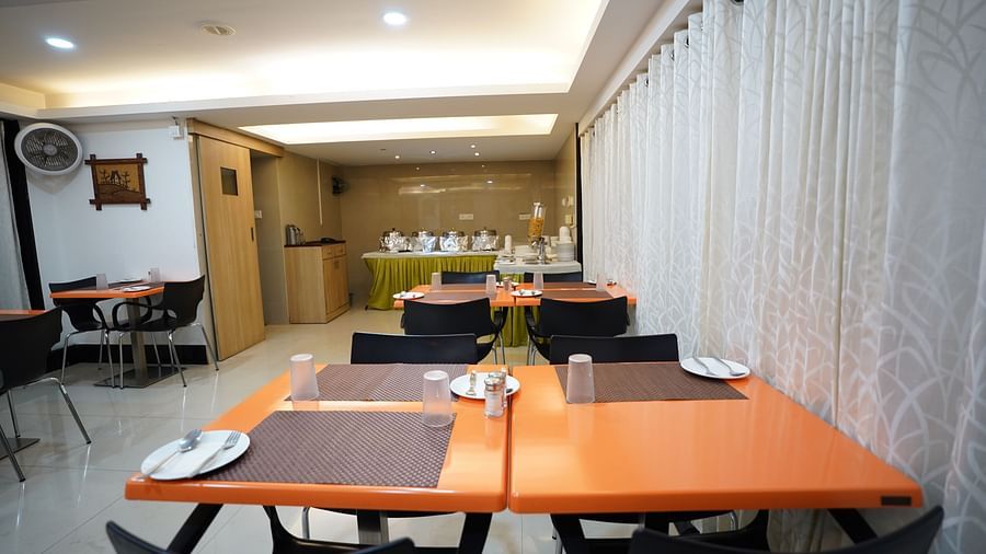an image of a dining space with tables and chairs at  City Centre Residency, Bangalore