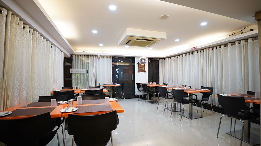 an image of a dining space with tables and chairs  at  City Centre Residency, Bangalore