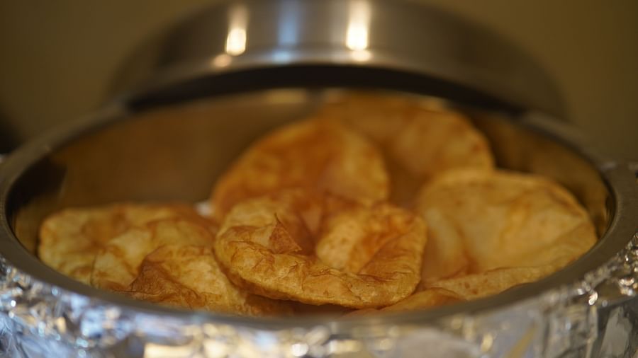 an image of poori kept inside a hot back at  City Centre Residency, Bangalore