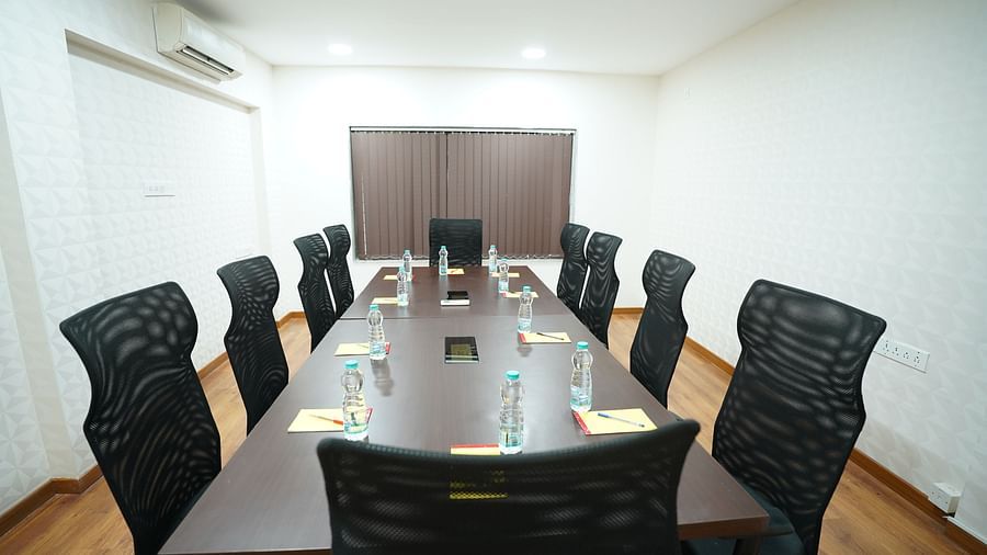 an image of a close up shot of a boardroom with water bottles placed on the table at  City Centre Residency, Bangalore