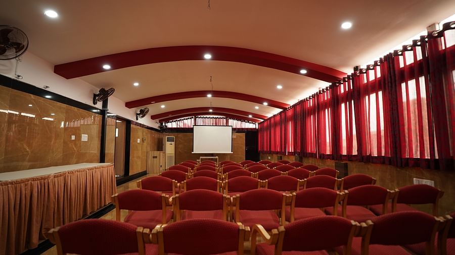 an image of an event space with chairs and a white screen to project  at  City Centre Residency, Bangalore