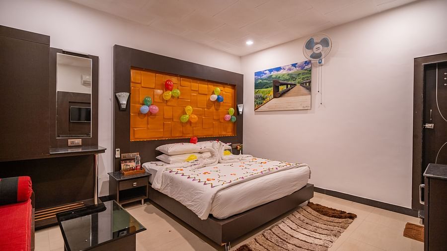 Image of a room with a bed and balloons attached to the headboard at Coorg Jungle Camp Backwater Resort, Kushalnagar.