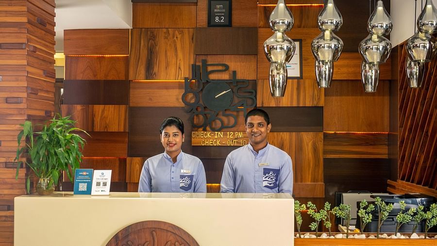 Image of two receptionists at the reception desk of Coral Reef Hotel and Spa in Port Blair