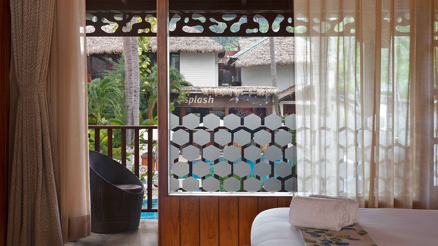 Coral Turquoise at Coral Reef Resort and Spa in Havelock featuring the door3way to the balcony with a seating space with pool view 