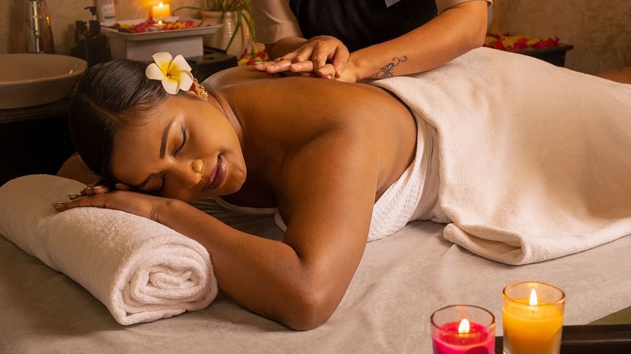 Image of a woman receiving back massages at Ayur Spa - Coral Reef Resort and Spa in Havelock
