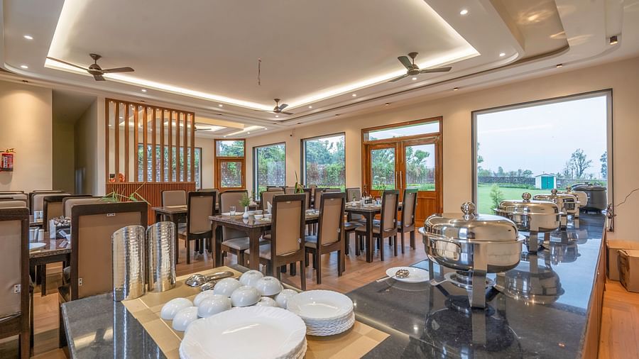 view of the buffet and tables inside Forest Haven Cafe at Corbett Four Seasons, Ramnagar