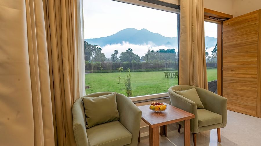 view of the seating area in the mountain view room at Corbett Four Seasons, Ramnagar
