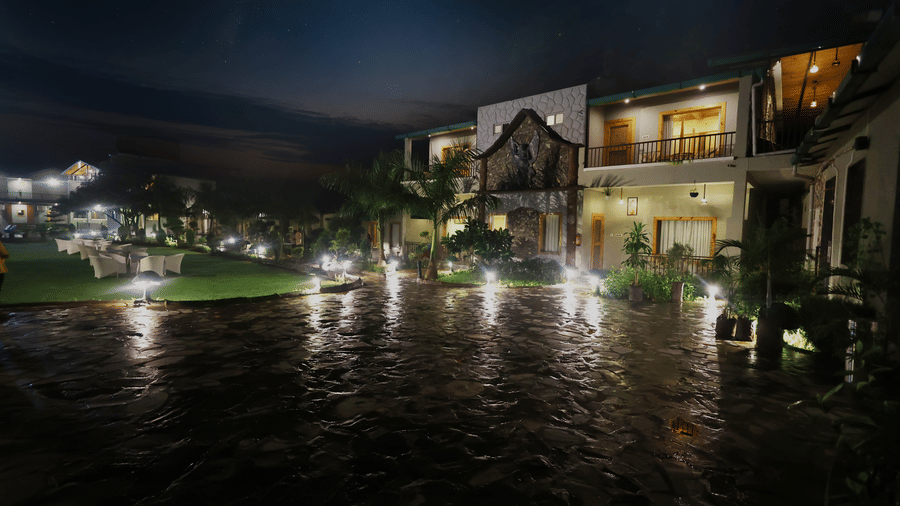 The expansive driveway in front of Lawn 2 well illuminated with exterior lighting at Corbett Nirvana Resort.