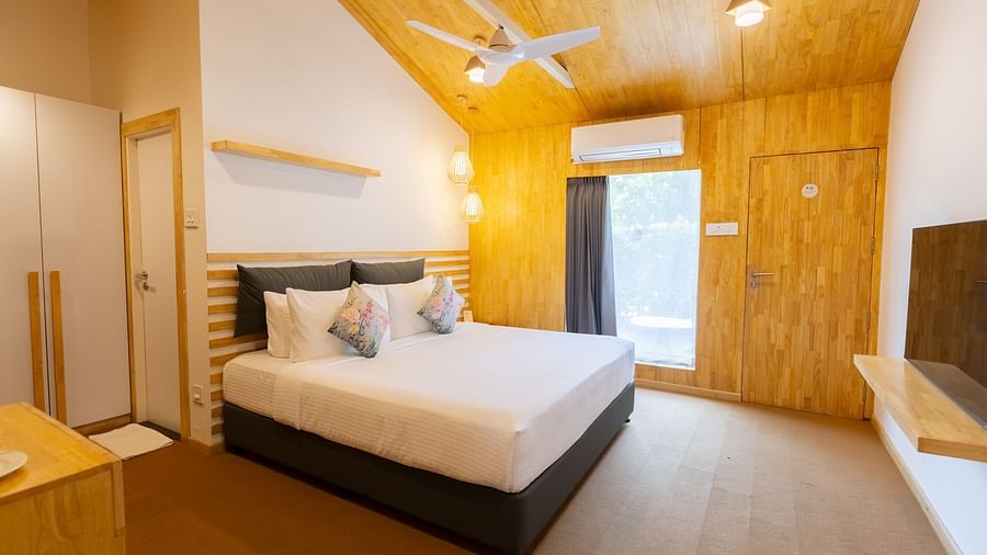image featuring a double bed at the premium room with sleek and modern interiors - Darza Resorts