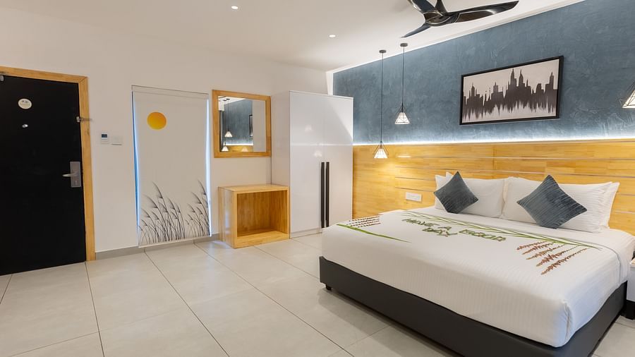 corner view image of the garden room along with a wardrobe in the corner - Darza Resorts 