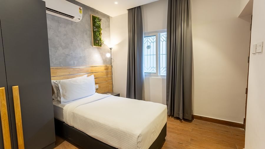 corner view of the room featuring a single bed in the luxury group stay villa - Darza Resorts