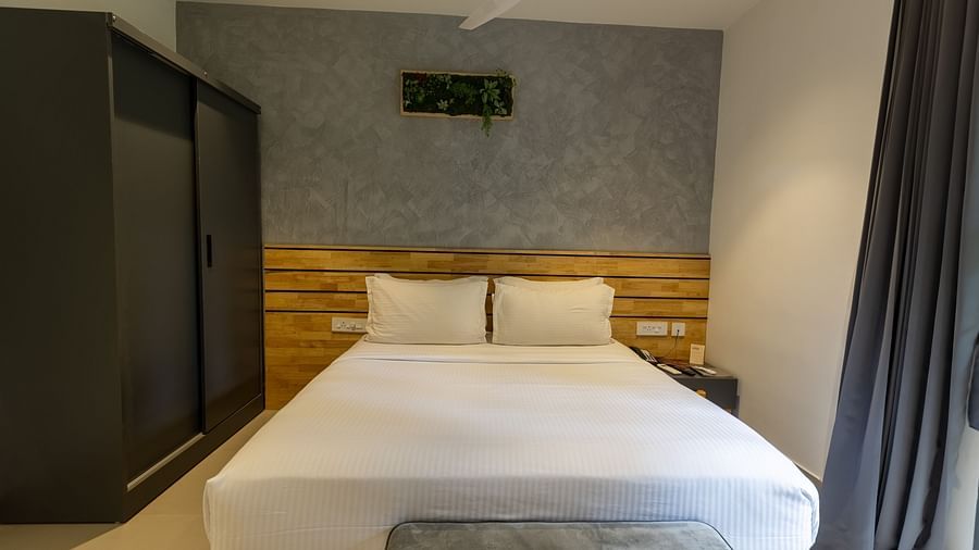 front view image of a comfortable double bed in a bedroom at the luxury group stay villa - Darza Resorts