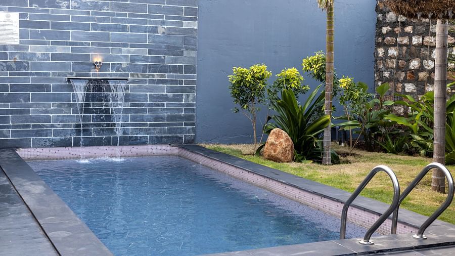 a close up image featuring a swimming pool in a luxury villa - Darza Resorts