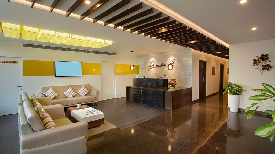 Another view of a view of the sleek and spacious lobby of our hotel with contemporary design and a reception area - De Venetian by TGI, Brookefield