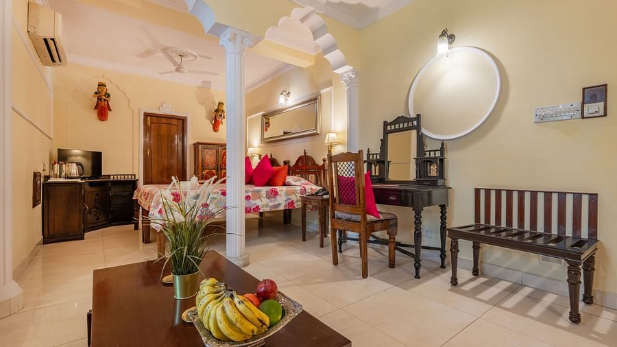 Spacious dining and sitting area with traditional décor and natural lighting at Dera Rawatsar, Jaipur