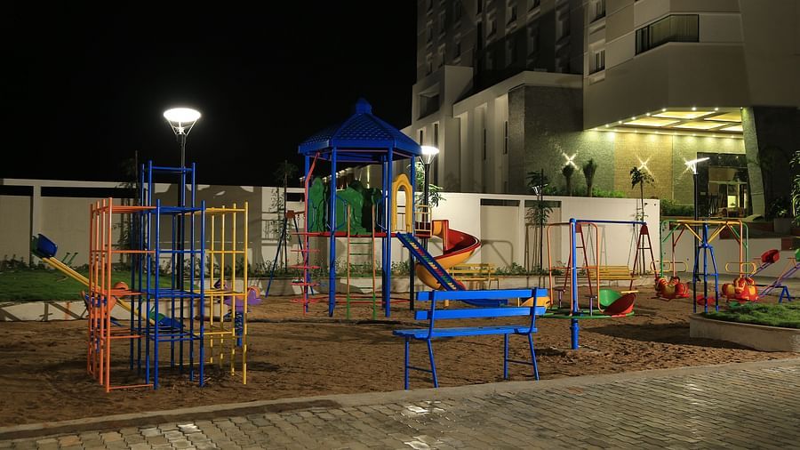 Kids play area at Dhanalakshmi Srinivasan Hotel, Perambalur with swings slides and other games.