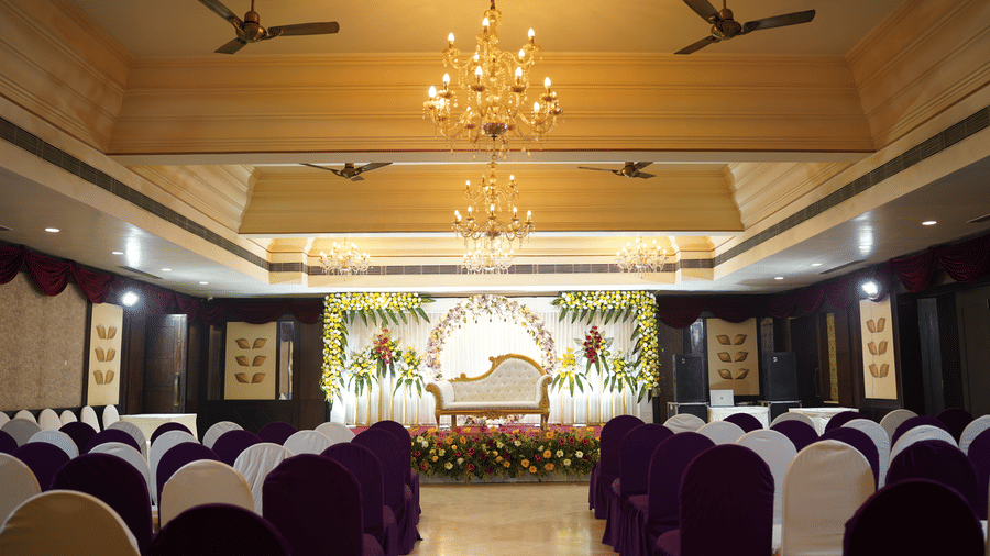 A decorated wedding stage features elegant lighting at Diamond Hotel Varanasi.