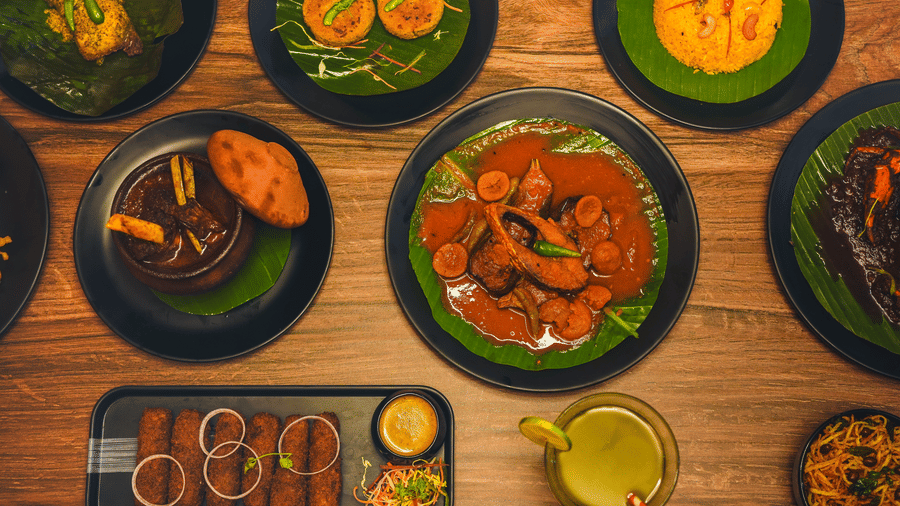 A large spread of authentic bengali cuisine featuring various dishes on the at Dip Holidays.