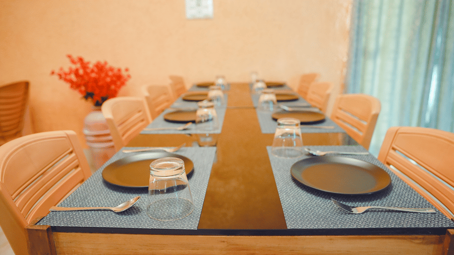 Private dining table set for guests with elegant tableware and décor.