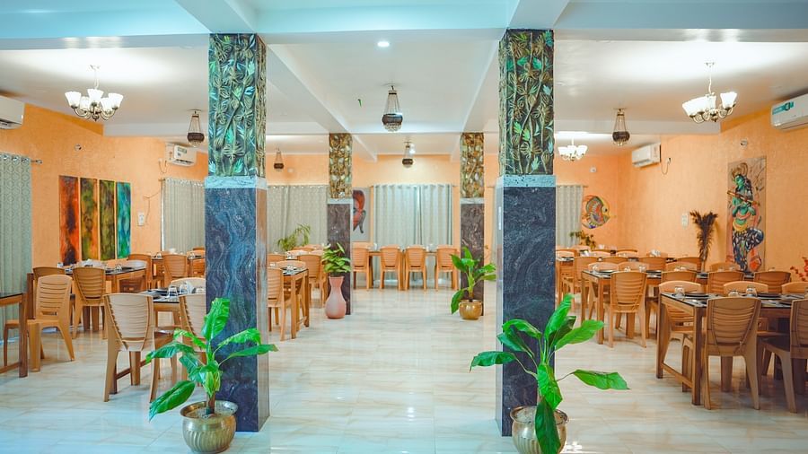 front view of the restaurant at dip holidays with green plants in the entrance