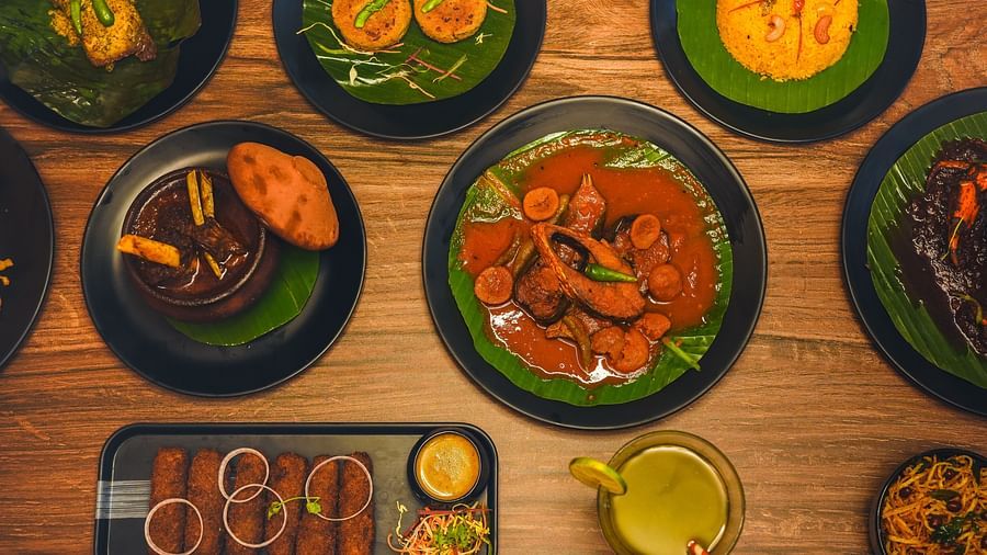 a wide spread of authentic bengali cuisine featuring various dishes on the table - Dip Holidays, Birbhum