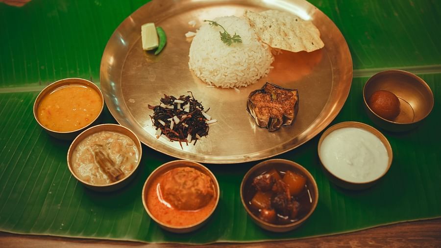 image featuring a whole benagli meal that includes several side dishes served with steamed rice - Dip Holidays, Birbhum
