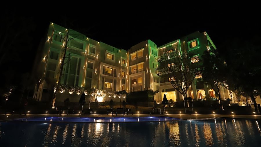 Night exterior view of Essentia Luxury Resort & Spa, Udaipur with the lights on 