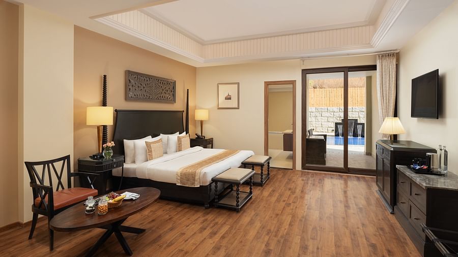 Presidential Suite Room with double beds placed in front of TV at Essentia Luxury Resort & Spa, Udaipur.