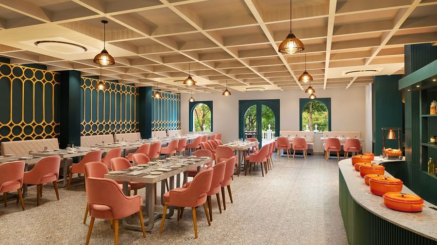 A dining setting of Blue Salt and Coffee at Essentia Luxury Resort & Spa, Udaipur.
