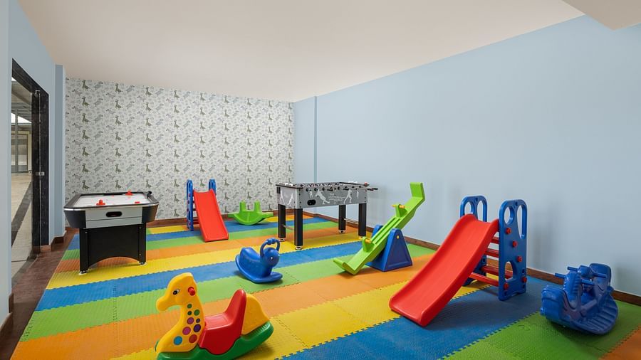 A playroom with toys placed on colourful mats at Essentia Luxury Resort & Spa, Udaipur.