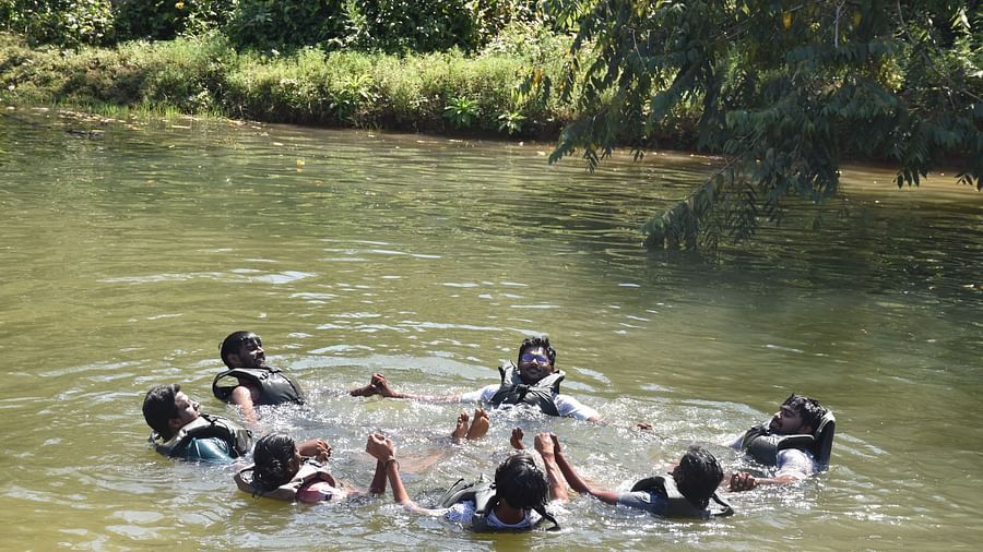 A group with life jackets enjoying the swimming pond - Evergreen County