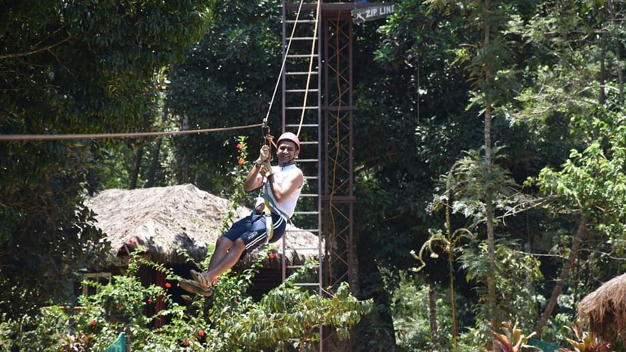 A person enjoying Zip line activity - Evergreen County