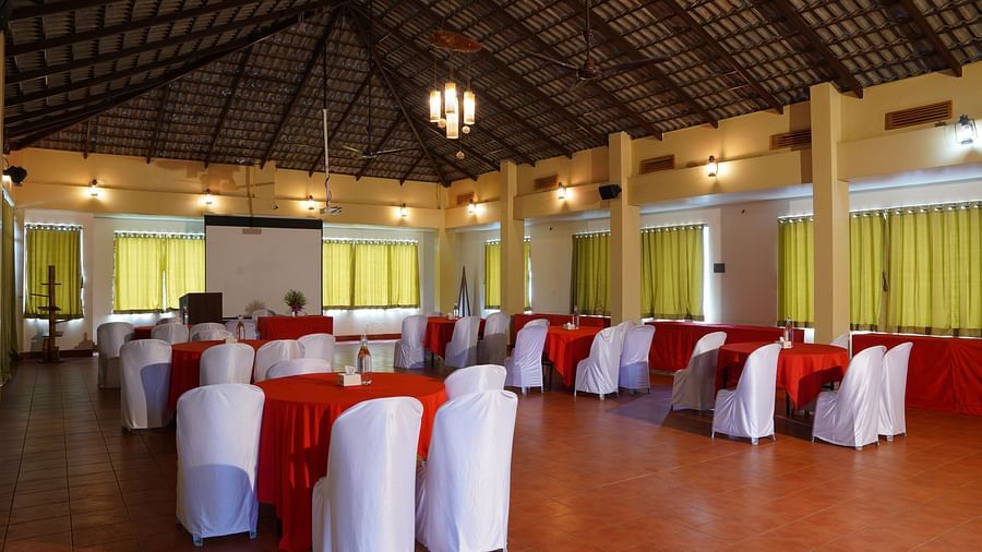The expansive banquet hall at Forest Escapes Koyna offers a large space for events and gatherings.