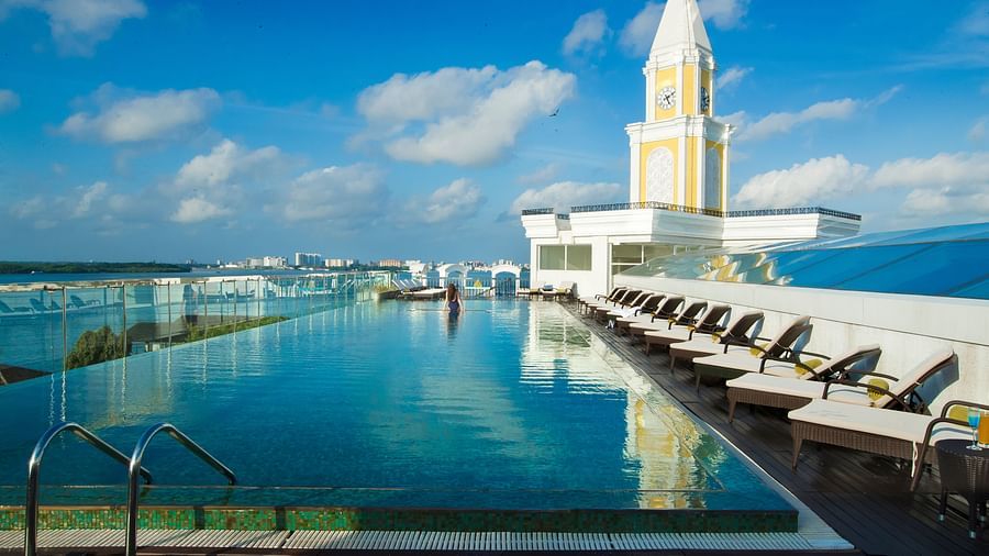 Swimming pool with a view aligning the sky and beach