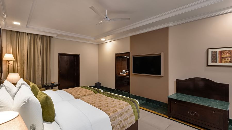 Ganga View Room with a work desk opposite to the bed and standing lamps - Ganga Lahari, Haridwar