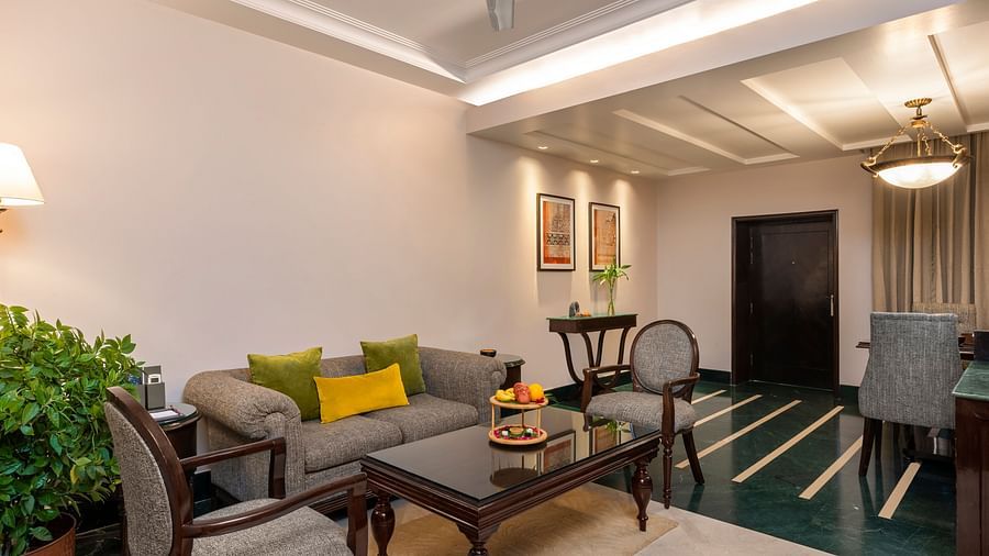 A modern home decorated for Diwali, with lights and flowers adorning the walls and windows.