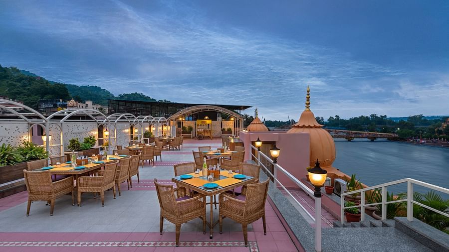 Enjoy a panoramic view of the Ganges River from the rooftop restaurant at Ganga Lahari Haridwar.