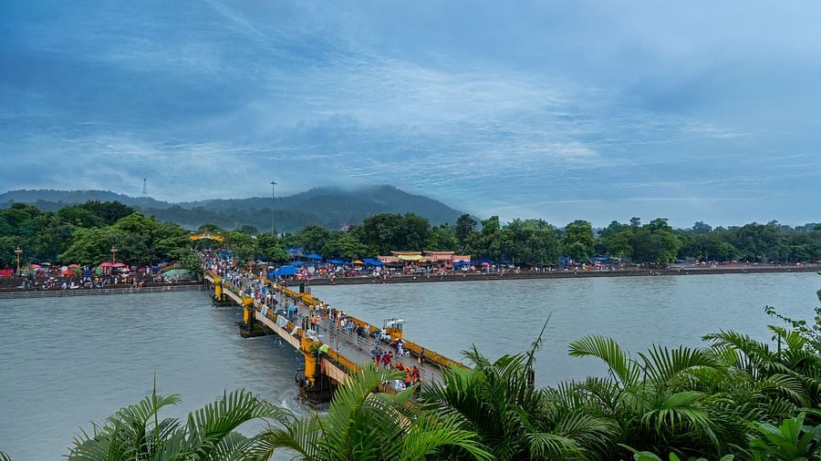 View from the Hotel of a bridge with people walking on it - Ganga Lahari, Haridwar