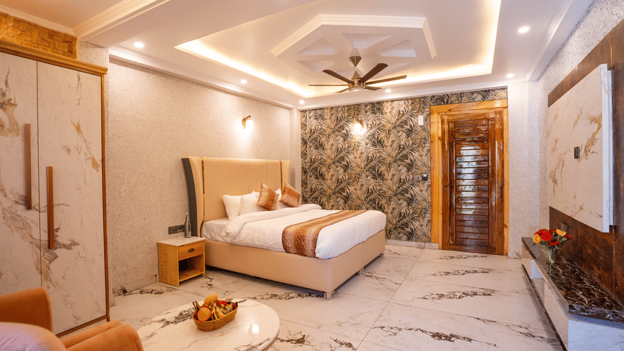 Full view of a premium room with marble-textured furniture and a cozy velvet armchair - Golden Oak By The Lake Hill, Khurpatal