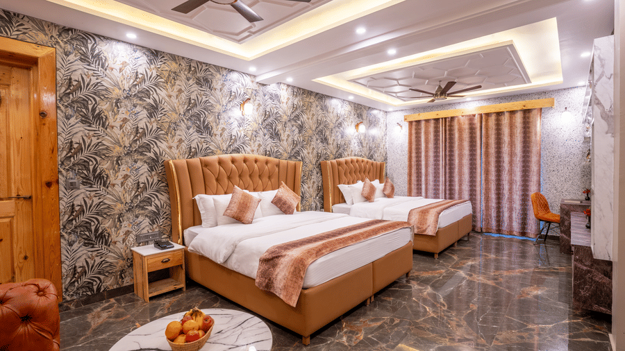 A spacious hotel room featuring twin beds with tufted headboards and dark polished marble floors - Golden Oak By The Lake Hill, Khurpatal