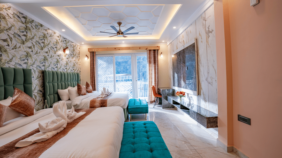A wide bedroom view showing twin beds with bright teal velvet end-of-bed benches - Golden Oak By The Lake Hill, Khurpatal
