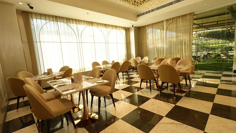 Elegant dining area with natural light and modern furniture - Grand Plaza Lords Inn Jammu