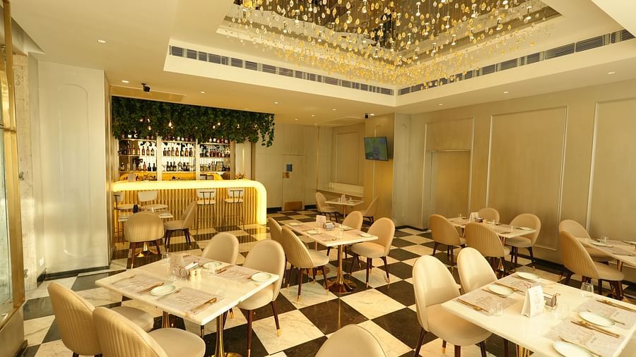 Stylish restaurant interior with modern decor and chandelier lighting - Grand Plaza Lords Inn Jammu