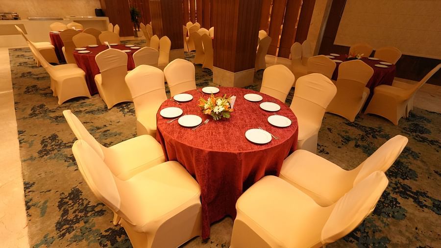 Table setup with fine dining crockery in a banquet hall - Grand Plaza Lords Inn Jammu