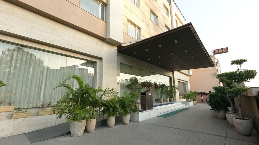 Hotel entrance with potted plants and signage - Grand Plaza Lords Inn Jammu