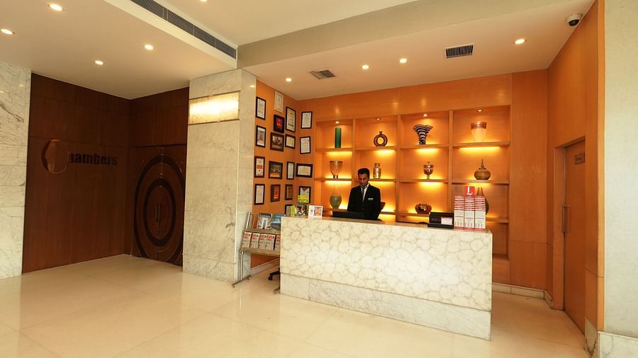 Hotel room entrance area with a mini-bar and warm ambient lighting - Grand Plaza Lords Inn Jammu