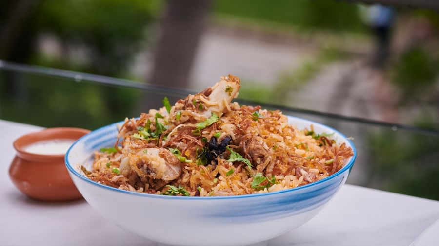 A bowl of biryani served with salad on the side at Grande Bay Resort & Spa.