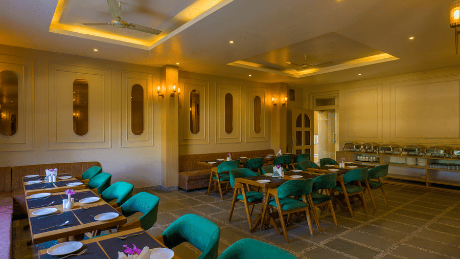Dining area with buffet counter behind at Amaya restaurant, Grassfield Riviera Resort near Jaipur.